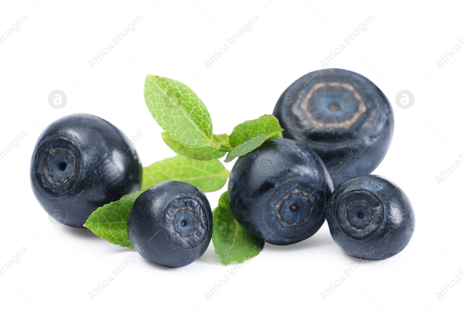 Photo of Tasty ripe bilberries and green leaves isolated on white