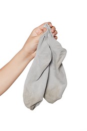 Photo of Woman holding dirty socks on white background, closeup