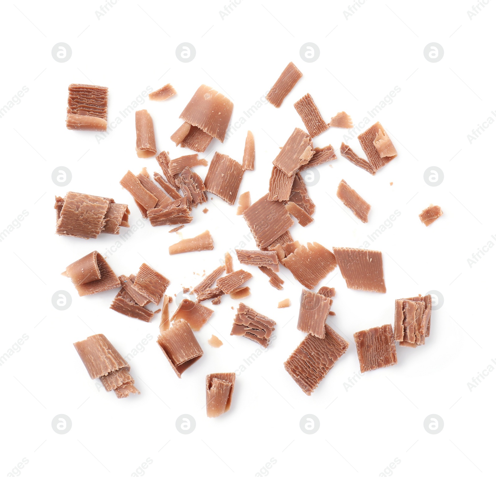 Photo of Many tasty chocolate shavings isolated on white, top view