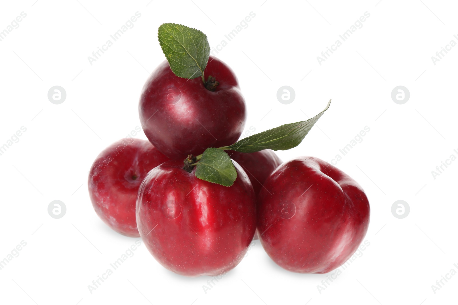 Photo of Delicious ripe plums with leaves isolated on white