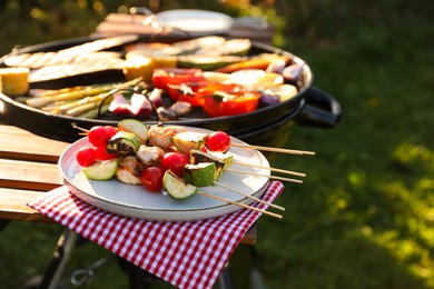 Photo of Cooked food products and grill barbecue outdoors