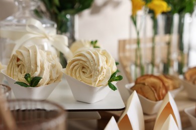 Photo of Tasty treats on table in room. Sweet buffet