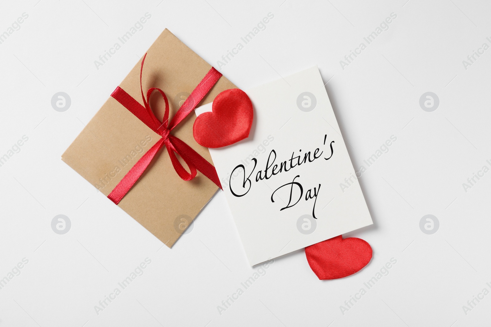 Image of Happy Valentine's Day. Flat lay composition with greeting card on white background