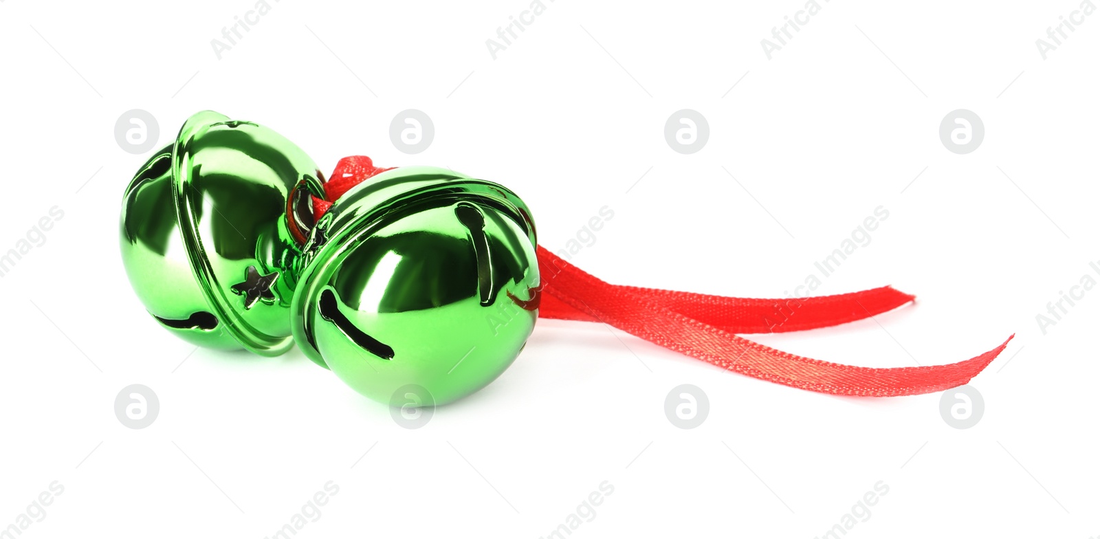 Photo of Shiny green sleigh bells with ribbon isolated on white