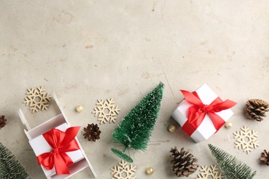 Photo of Beautiful Christmas composition with miniature sleigh on light table, flat lay. Space for text