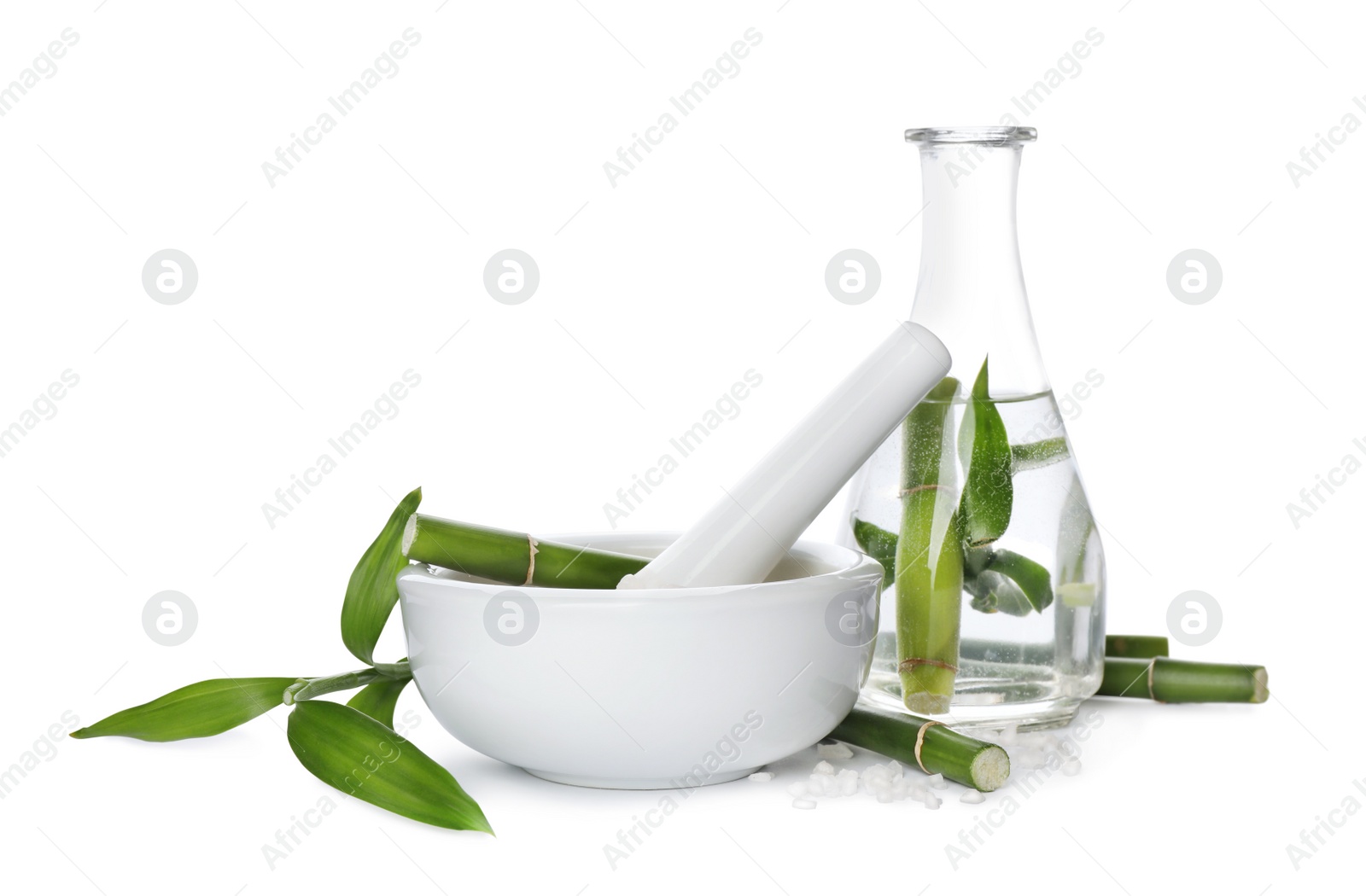 Photo of Composition with fresh bamboo and bath salt on white background. Spa procedure