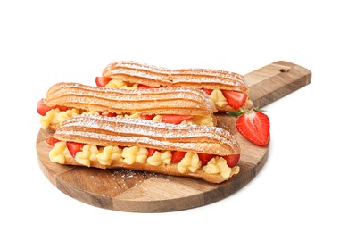 Photo of Delicious eclairs filled with cream and strawberries isolated on white