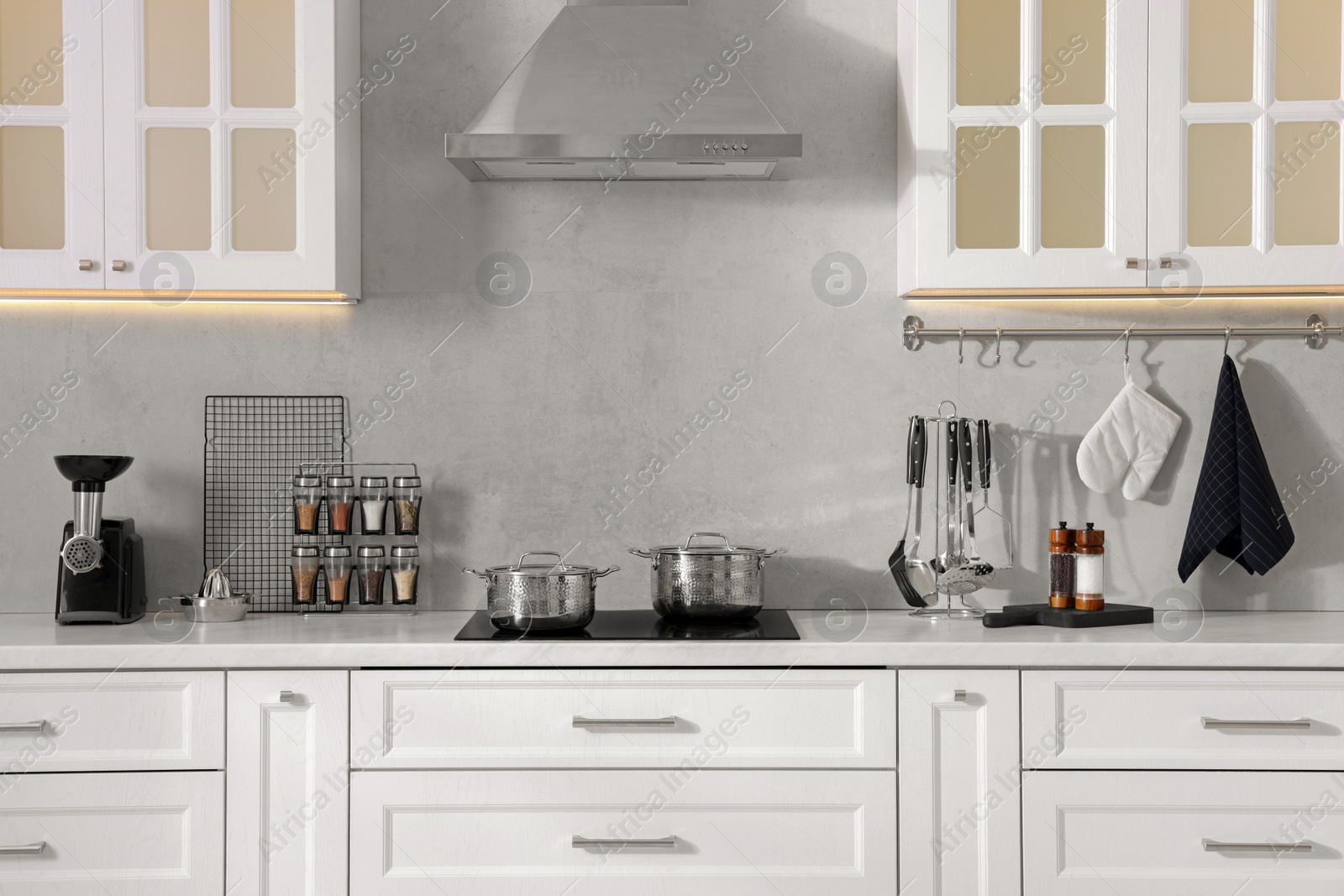 Photo of Set of different utensils on countertop in kitchen