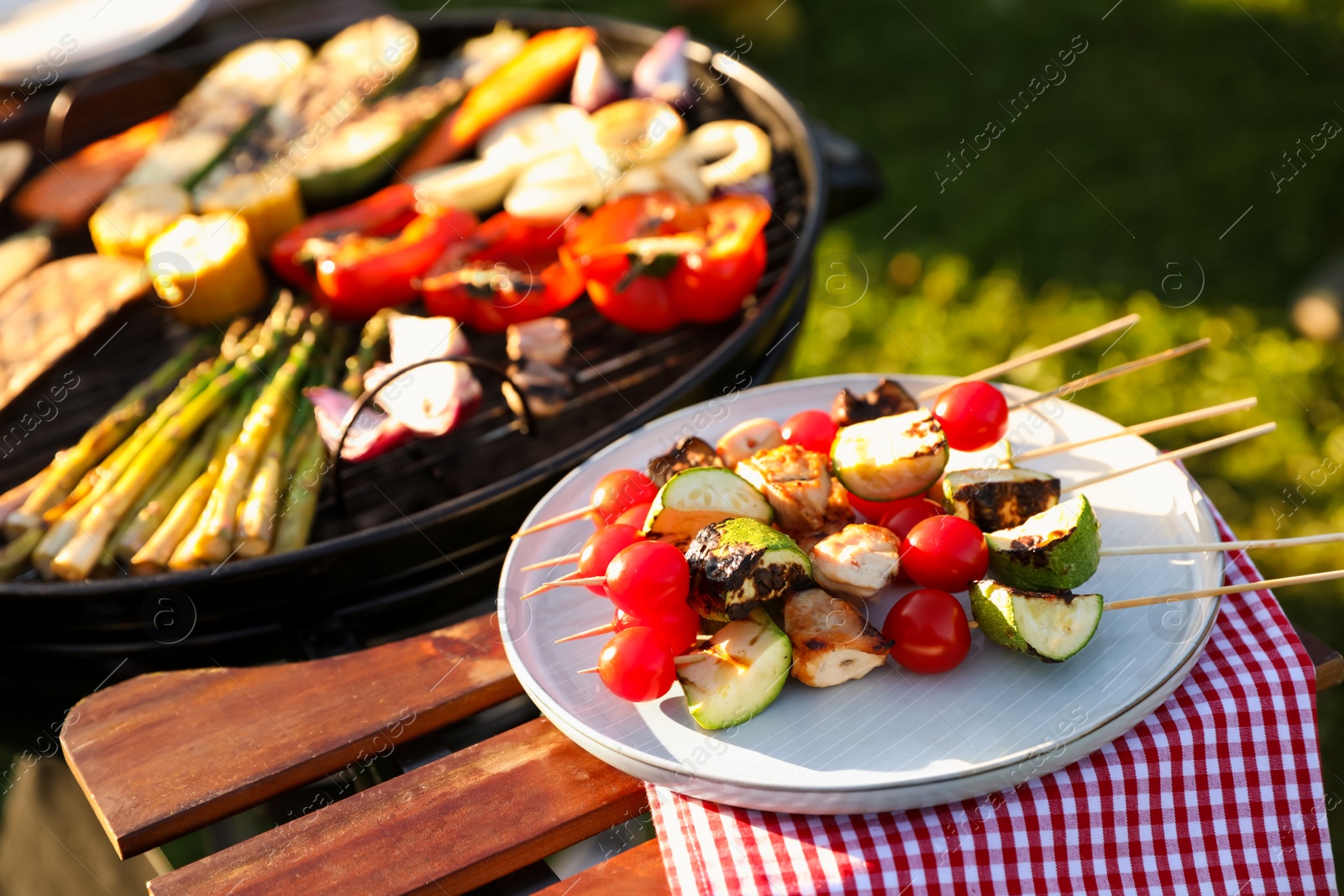 Photo of Cooked food products and grill barbecue outdoors