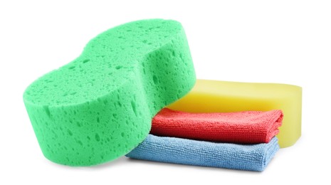 Photo of Sponges and car wash cloths on white background