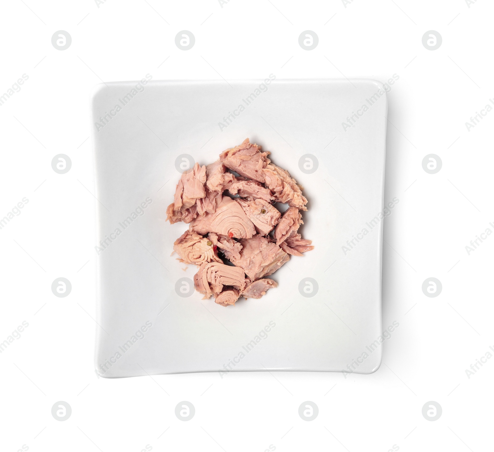 Photo of Plate with canned tuna on white background, top view