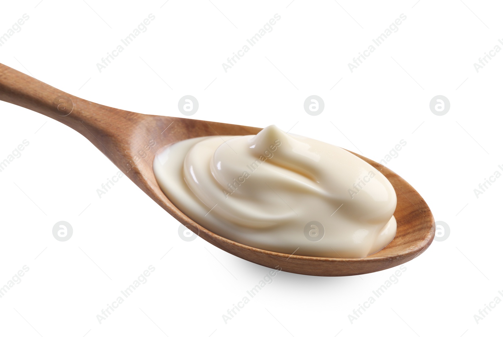 Photo of Natural yogurt in wooden spoon isolated on white