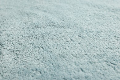 Soft light blue towel as background, closeup