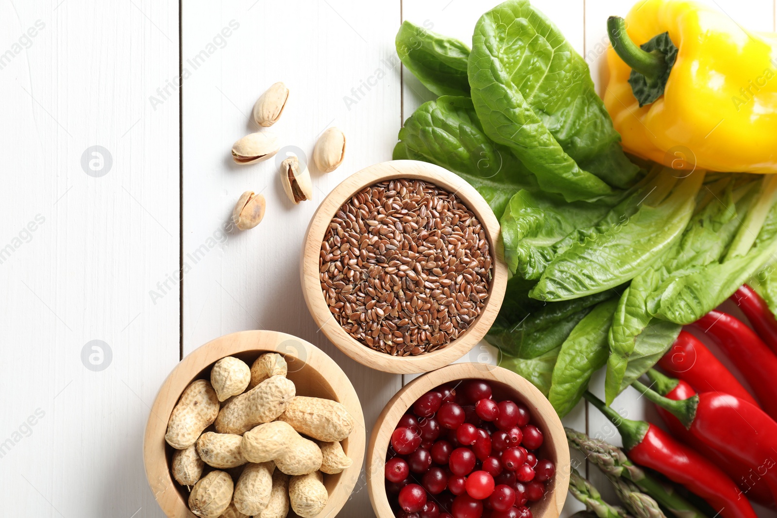 Photo of Many different healthy food on white wooden table, flat lay