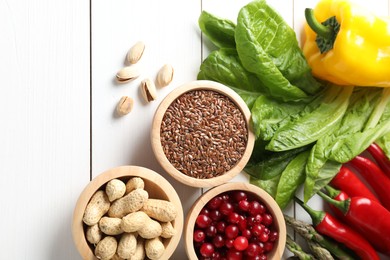 Many different healthy food on white wooden table, flat lay