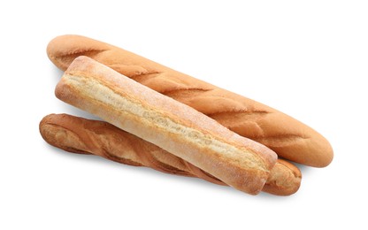 Photo of Different tasty baguettes on white background, top view. Fresh bread