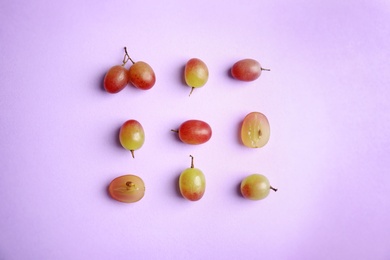 Fresh ripe juicy grapes on color background, top view