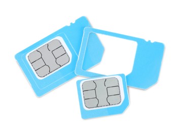 Light blue SIM cards on white background, top view