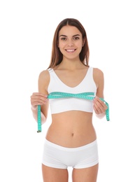 Photo of Slim woman measuring her chest on white background. Weight loss