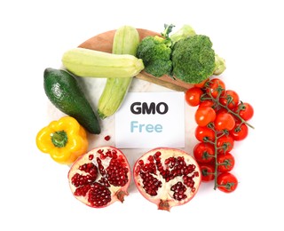 Tasty fresh GMO free products and paper card on white background, top view