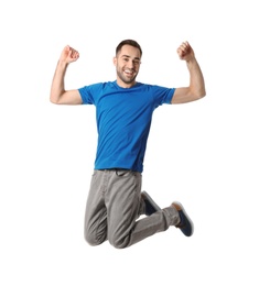 Full length portrait of happy handsome man jumping on white background