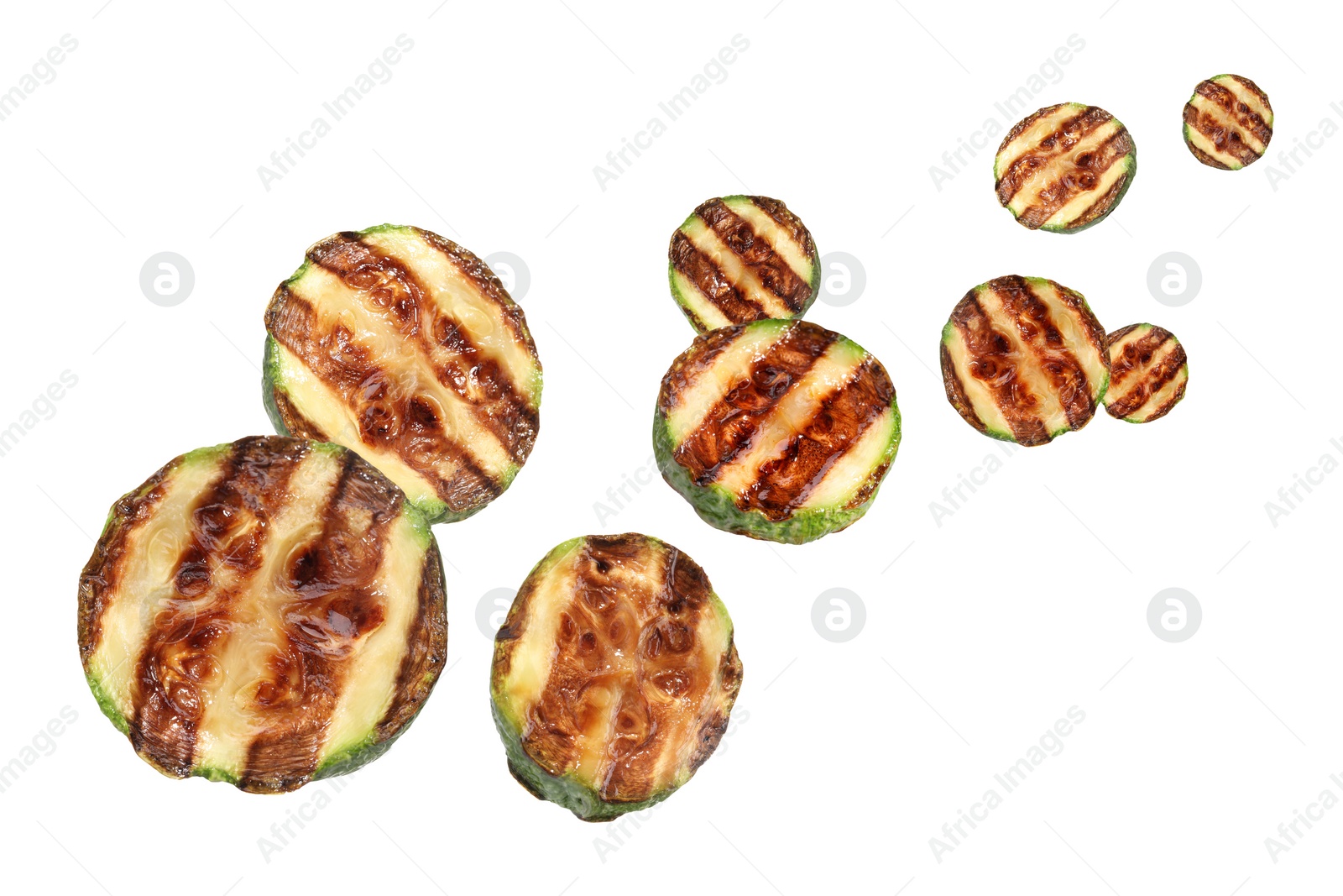 Image of Slices of grilled zucchinis in air on white background