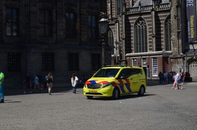 AMSTERDAM, NETHERLANDS - JULY 16, 2022: Modern ambulance vehicle on city street