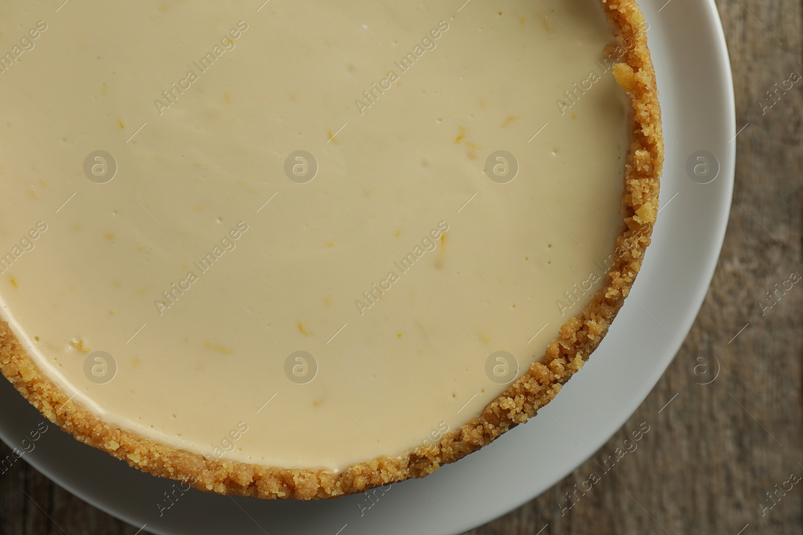 Photo of Tasty vegan tofu cheesecake on table, top view