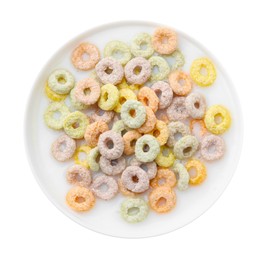 Photo of Tasty colorful cereal rings and milk in bowl isolated on white, top view