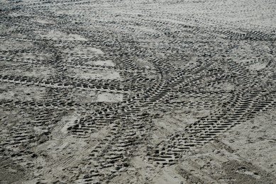 Photo of View of vehicle tire marks on sand