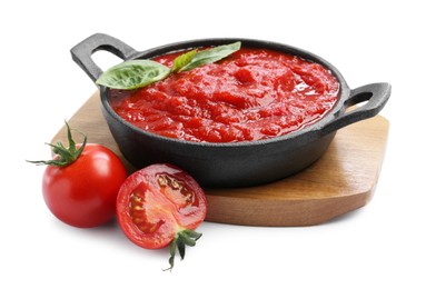 Photo of Homemade tomato sauce in bowl and fresh ingredients isolated on white