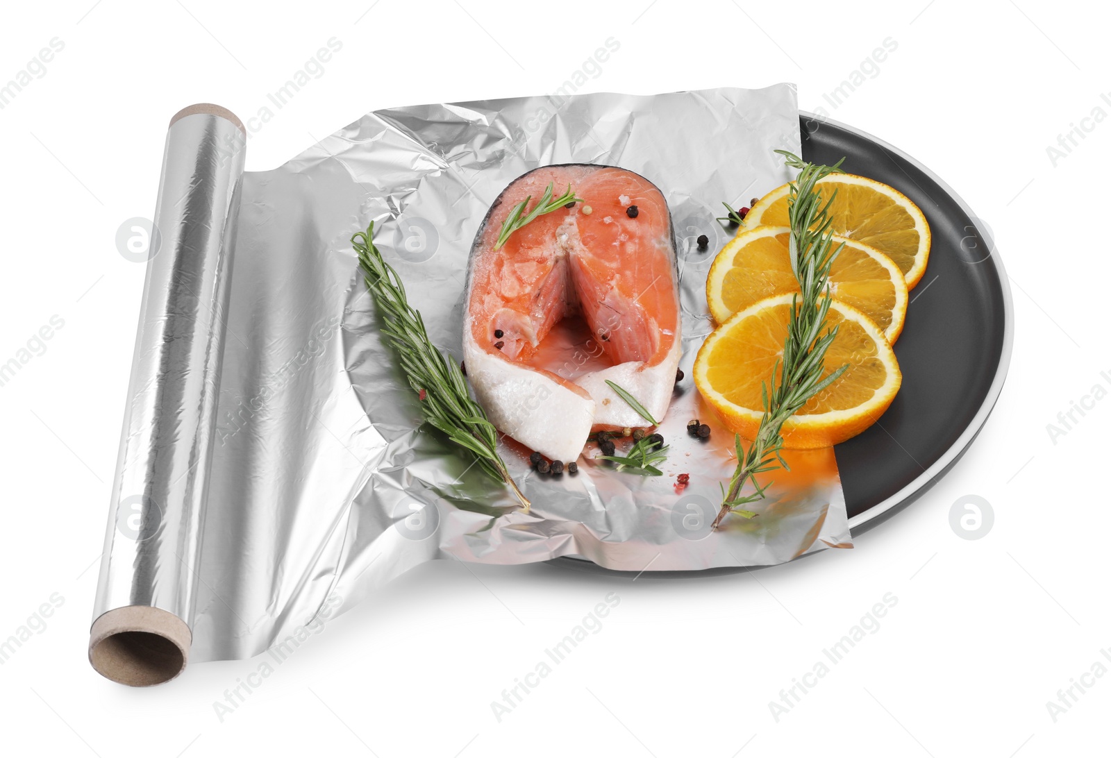 Photo of Aluminum foil with raw salmon, orange slices, rosemary and spices isolated on white