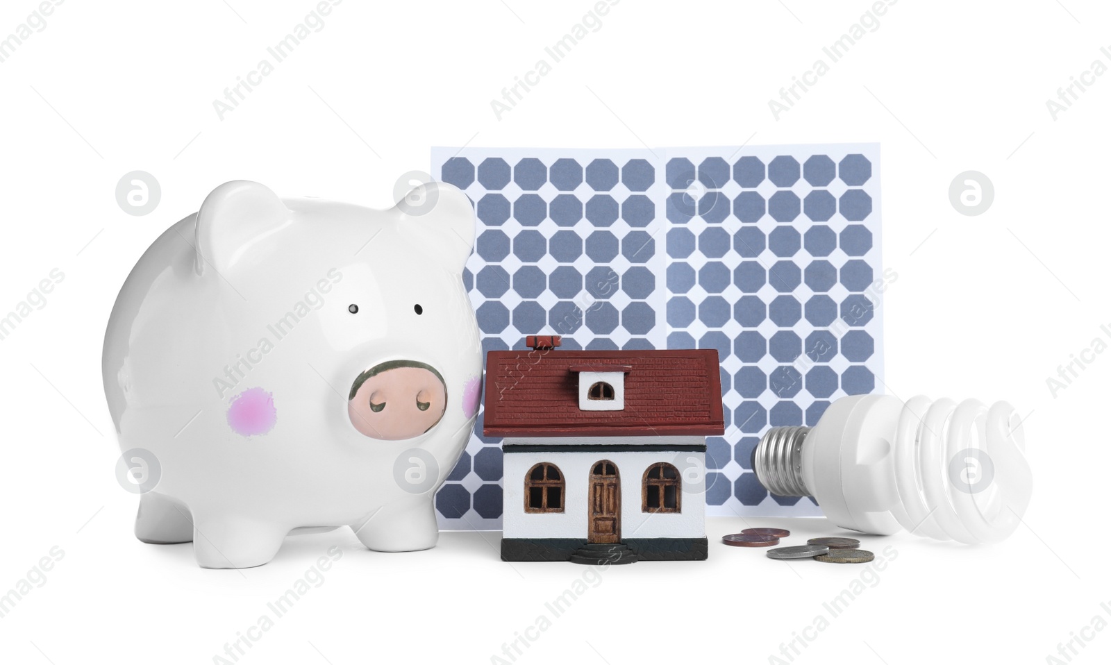 Photo of Composition with solar panels and piggy bank on white background