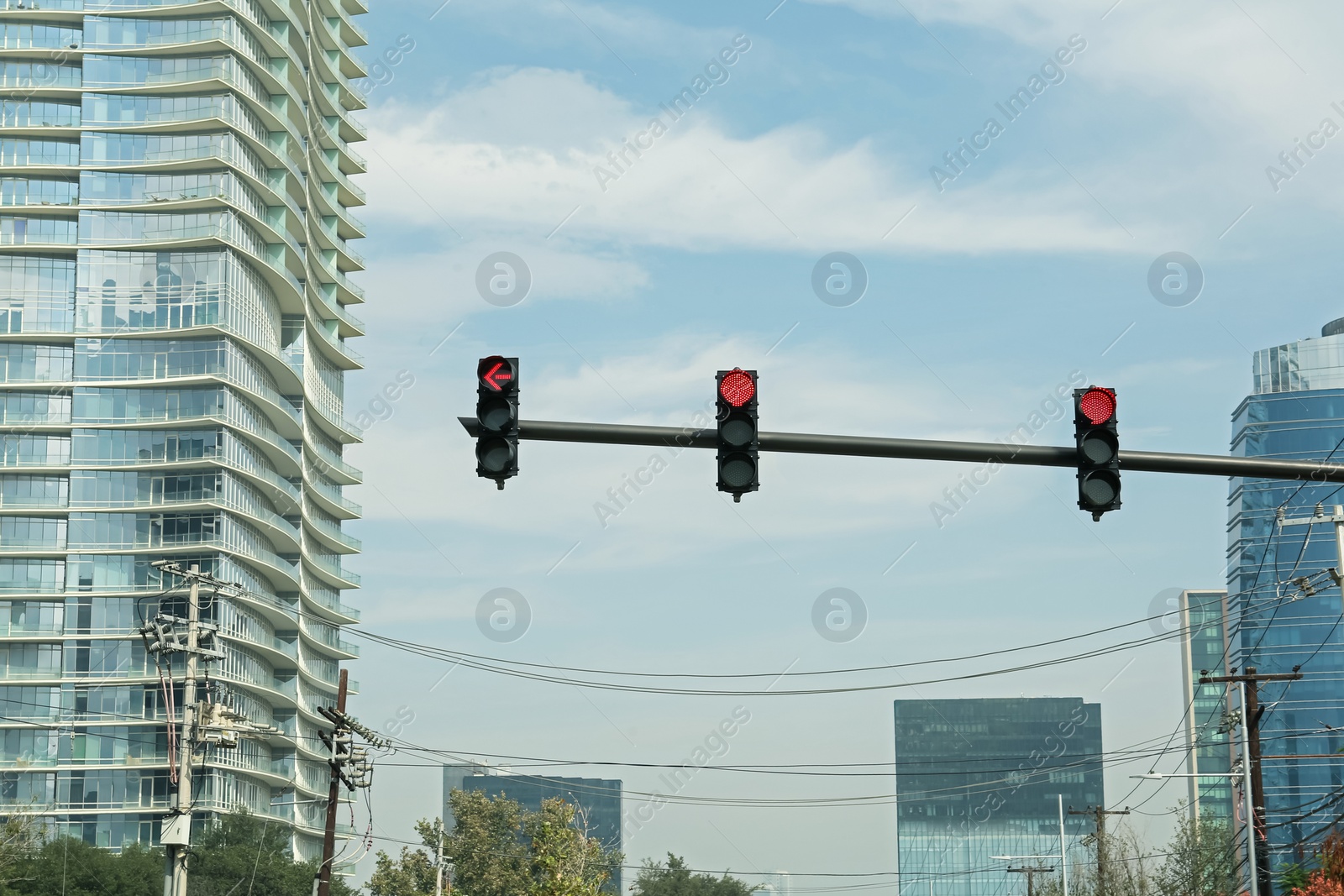 Photo of Overhead traffic lights in city. Road rules