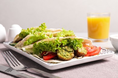 Photo of Delicious fresh vegan tacos served on table