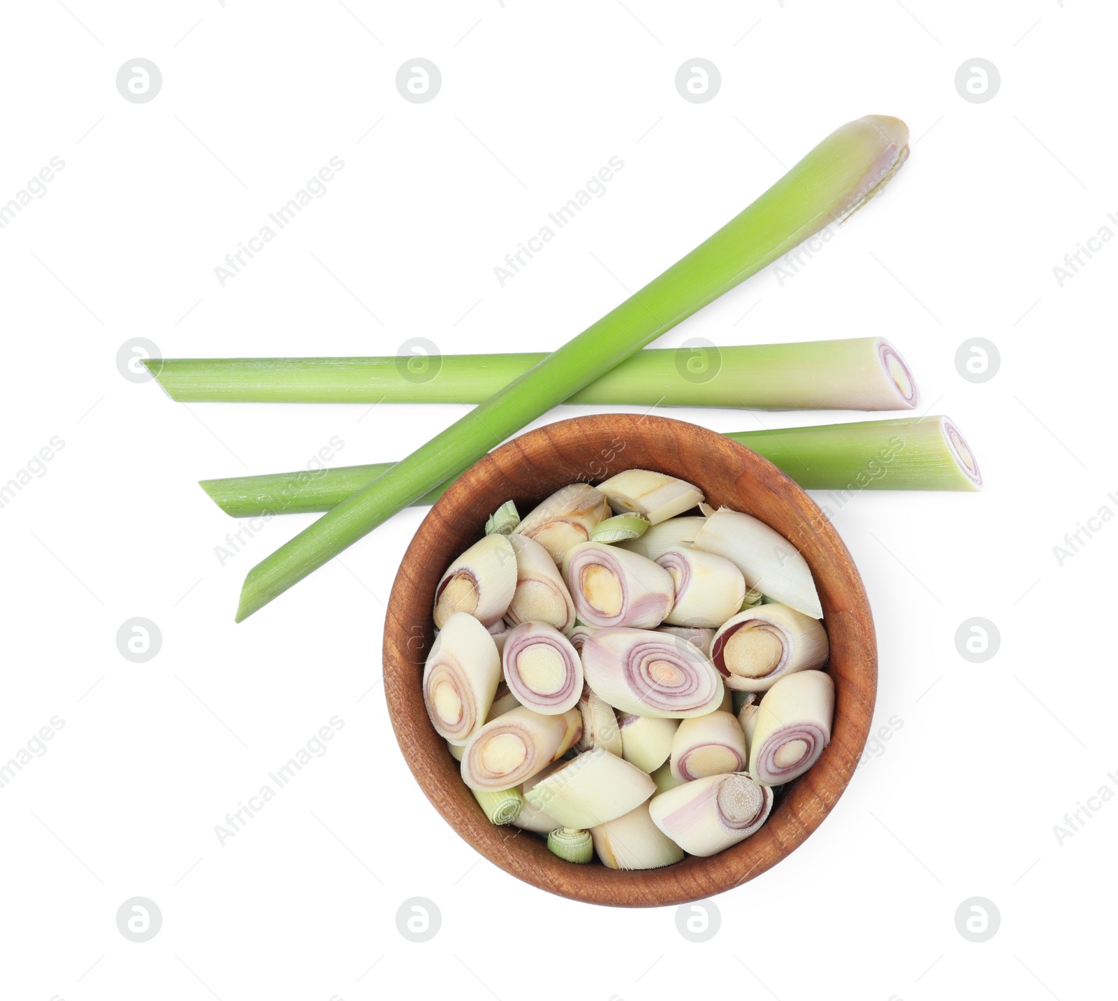 Photo of Whole and cut fresh lemongrass on white background, top view