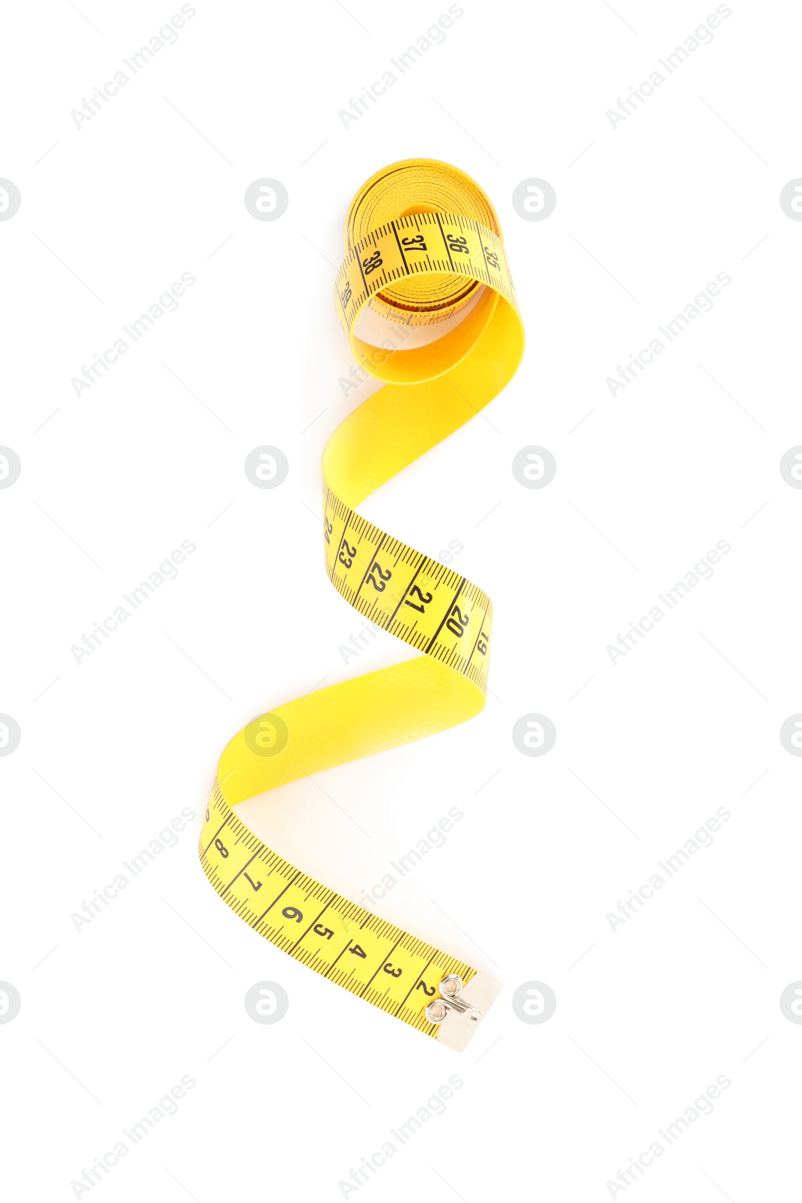 Photo of New yellow measuring tape isolated on white, top view