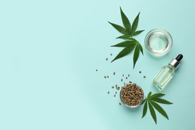 Photo of Flat lay composition with CBD oil or THC tincture and hemp leaves on light blue background, space for text