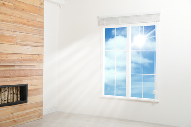 Image of Beautiful view on blue sky with clouds through window in room