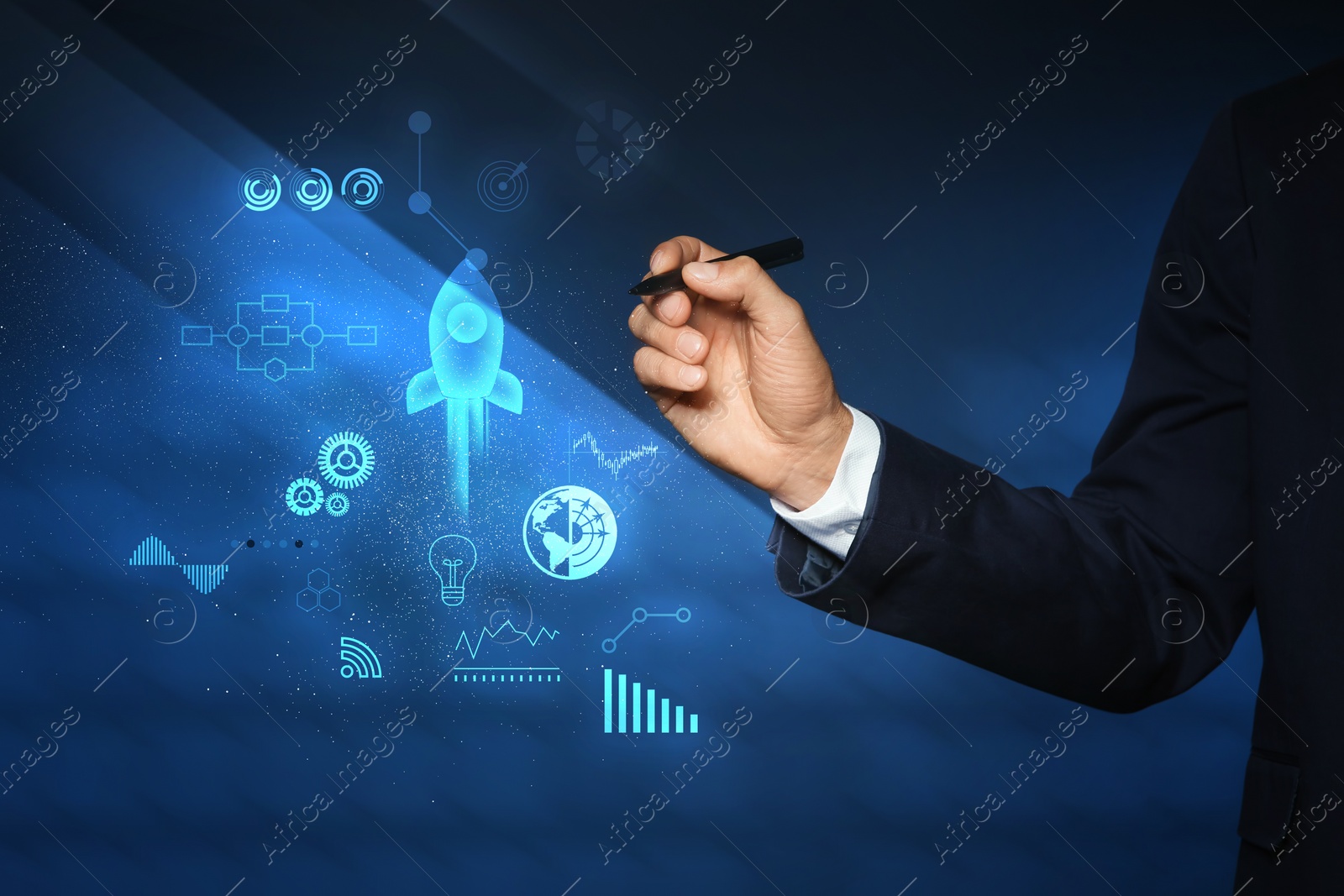 Image of Startup concept. Businessman with pen on dark blue background, closeup