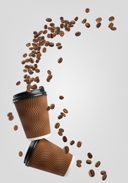 Image of Coffee to go. Paper cups and roasted beans flying on light background