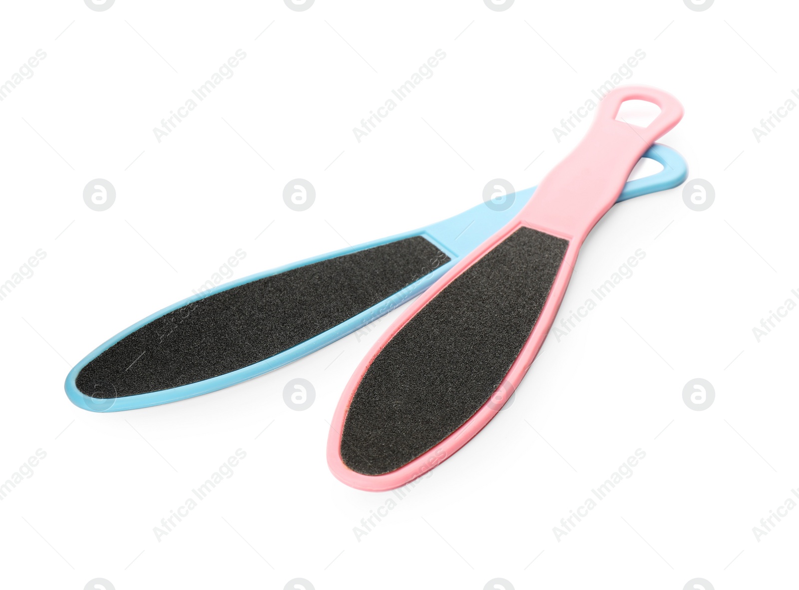 Photo of Colorful foot files on white background. Pedicure tools