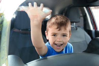 Screaming little boy closed inside car. Child in danger
