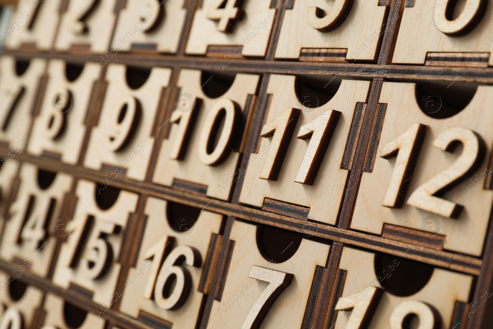 Photo of Wooden advent calendar, closeup view. Christmas season