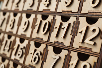 Photo of Wooden advent calendar, closeup view. Christmas season