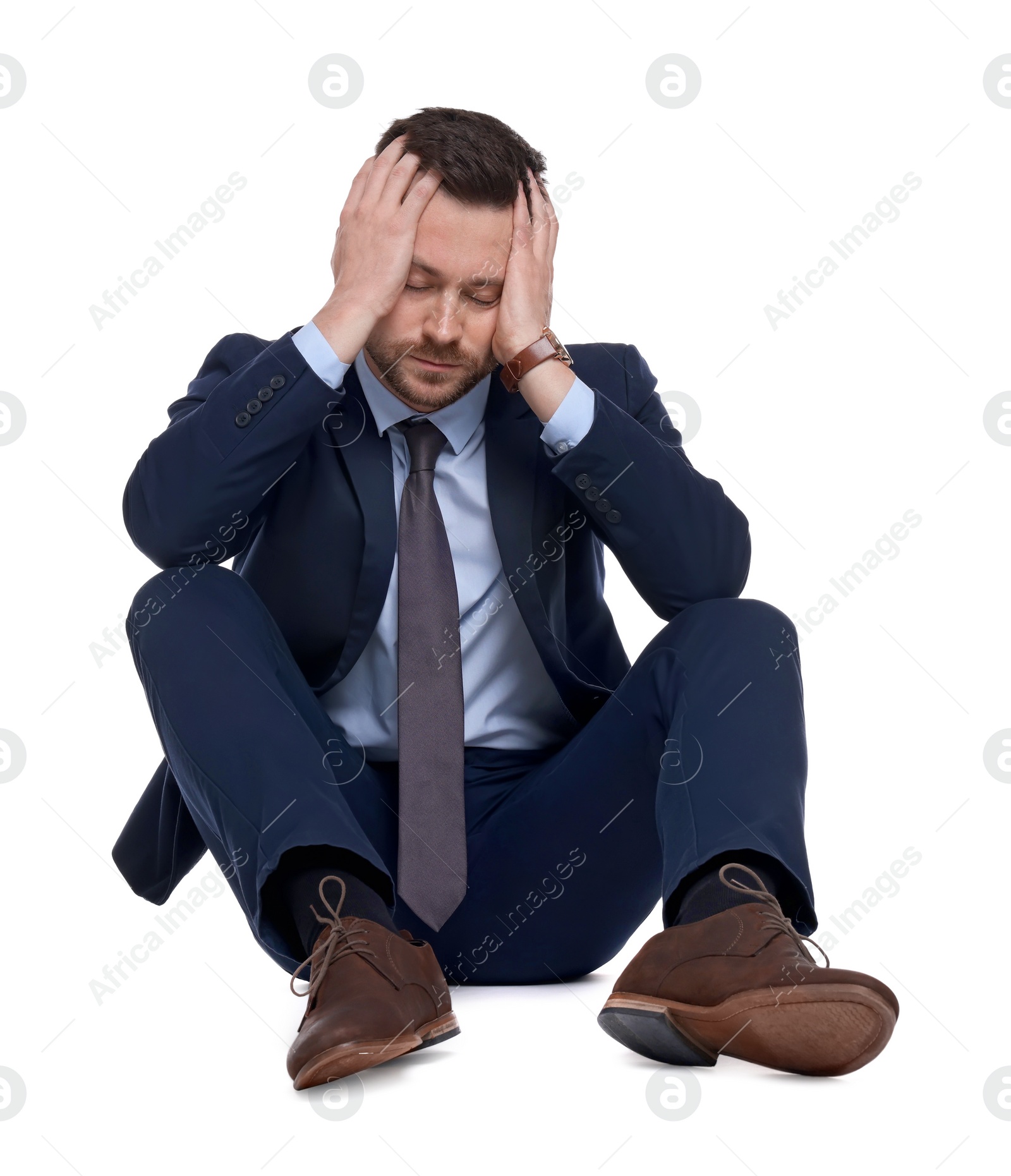 Photo of Upset bearded businessman in suit on white background