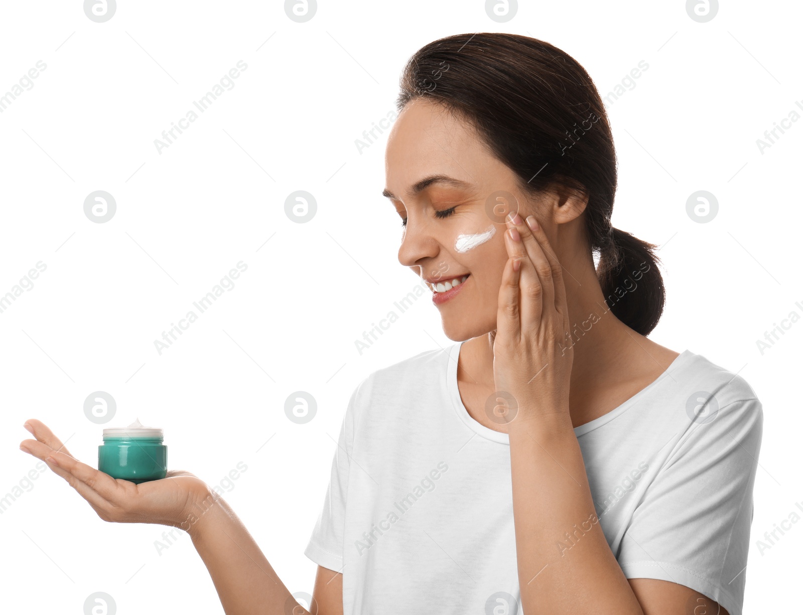 Photo of Woman applying facial cream on white background