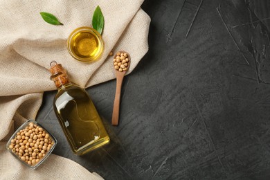 Photo of Flat lay composition with soybean oil on grey table. Space for text