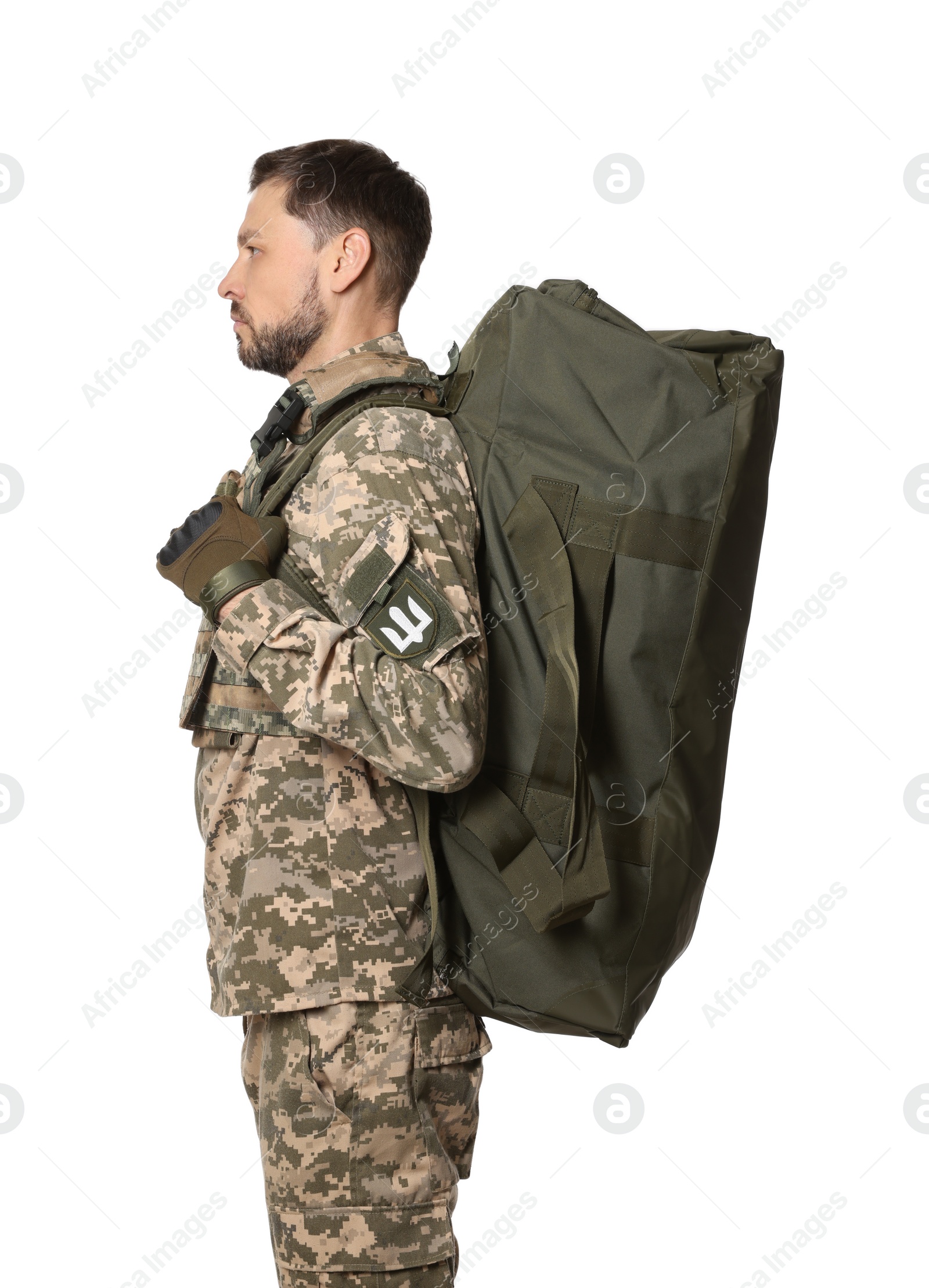 Photo of Ukrainian soldier in military uniform with army bag on white background