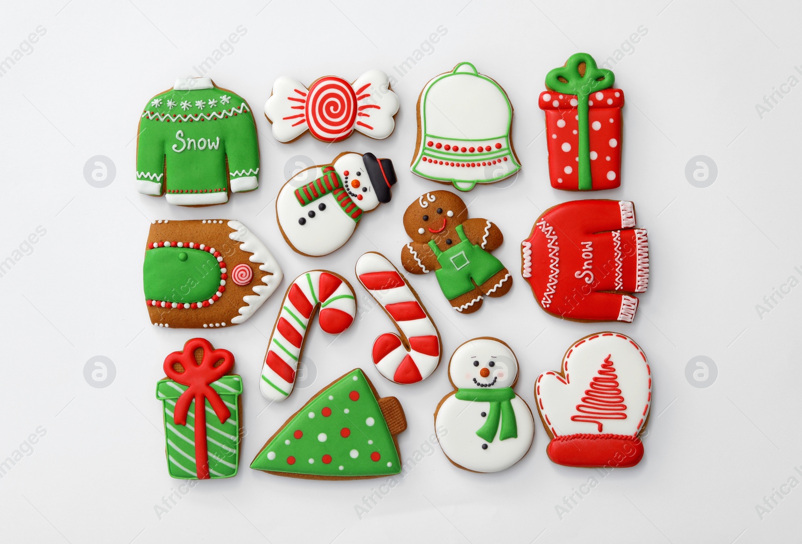 Photo of Different Christmas gingerbread cookies on white background, top view